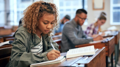 Cropped shot of university students sitting in class